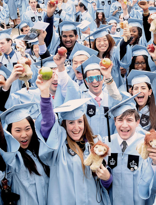 The newest College alumni show their school pride with lions and apples. Photo: Eileen Barroso
